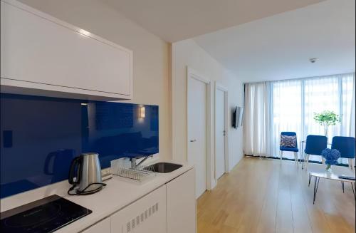 a kitchen with a sink and a counter top at Batumi black sea view central Hotel in Batumi