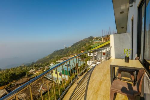 a balcony with a view of the ocean at Srilak View Holiday Inn in Haputale
