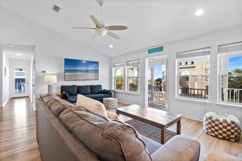 a living room with a couch and a table at Touch of Heaven in Pensacola Beach
