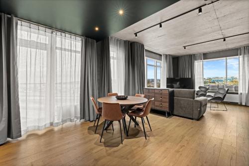 a living room with a table and a couch at Aurora Nooks by Heimaleiga in Reykjavík