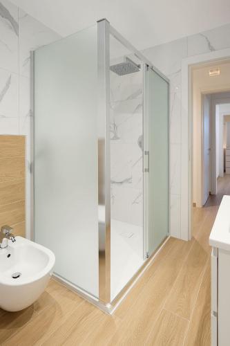 a bathroom with a glass shower and a sink at Casa DeDa-Mare & Design on the Trabocchi Coast in Fossacesia