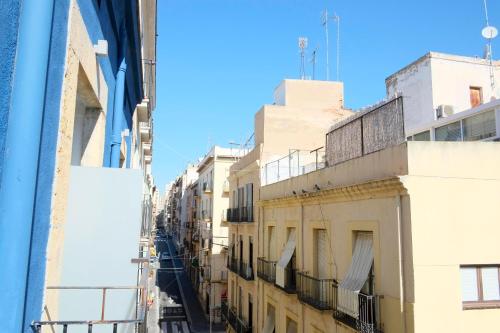 a view of an alley between buildings at Pigal in Tarragona