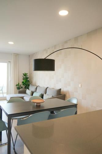 a living room with a couch and a table at Aqua Apartments Bellamar, Marbella in Marbella