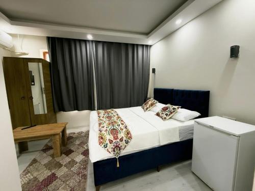 a small bedroom with a bed and a window at BDK hotel in Istanbul