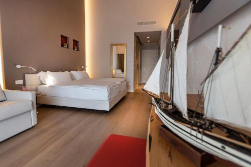 a hotel room with a bed and a tv at Locanda Monte Baldo in Malcesine
