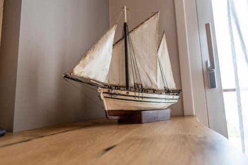 a model of a boat on display in a room at Locanda Monte Baldo in Malcesine