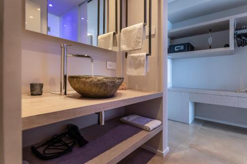 a bathroom with a bowl sink on a counter at Locanda Monte Baldo in Malcesine