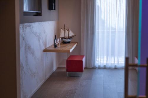 a room with a desk with a model ship on it at Locanda Monte Baldo in Malcesine