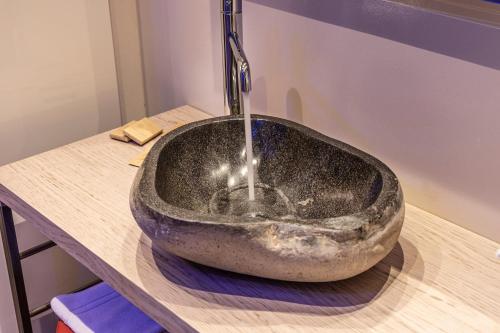 a large stone sink sitting on top of a counter at Locanda Monte Baldo in Malcesine