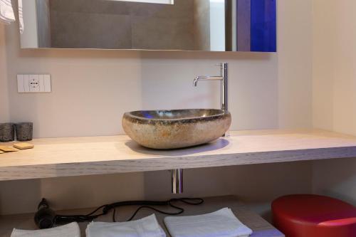 a bathroom with a bowl sink on a counter at Locanda Monte Baldo in Malcesine
