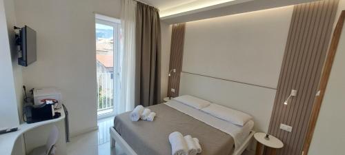 Katil atau katil-katil dalam bilik di Diamond Rooms Tropea