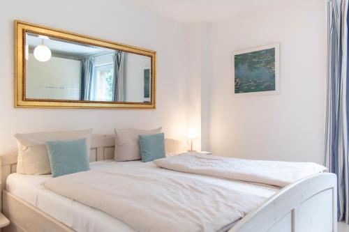 Postel nebo postele na pokoji v ubytování Ferienwohnung Mare Time 1