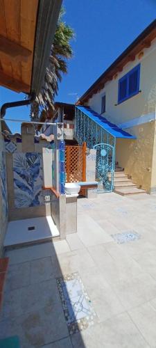 a building with a staircase and a building with a building at Buena Vista in SantʼAntìoco