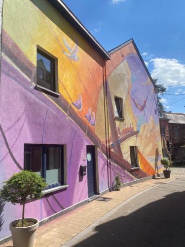 a mural on the side of a building at Le gîte de Giulia in Dinant