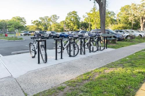 a row of bikes parked on a sidewalk at Luxury Apt in Passaic