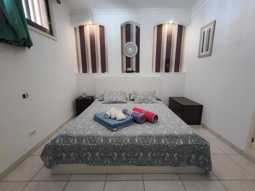 a bedroom with a bed with two pillows on it at Cozy Ocean Park in Adeje