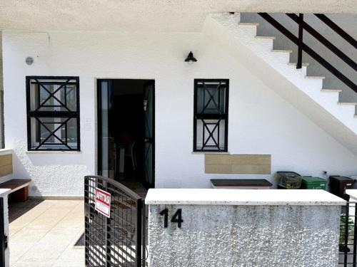 a white house with a staircase and a door at Casa vacanze Stella in Silvi Marina