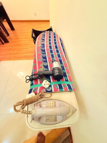 a scale sitting on a table with a towel at Park View Service Apartment By Kualalampur in Kuala Lumpur