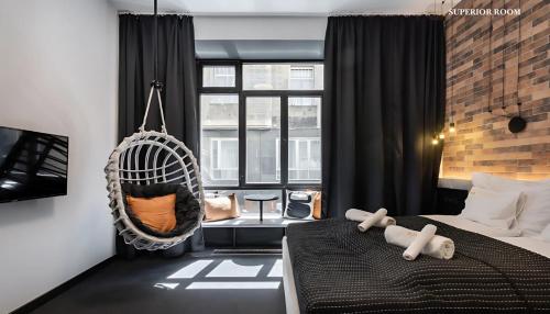 Postel nebo postele na pokoji v ubytování Váci Loft Suites