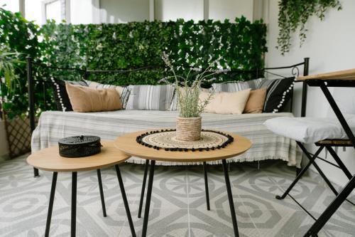 a patio with a couch and a table with a table sidx sidx sidx at Inspiration Project A3 in Alexandroupoli