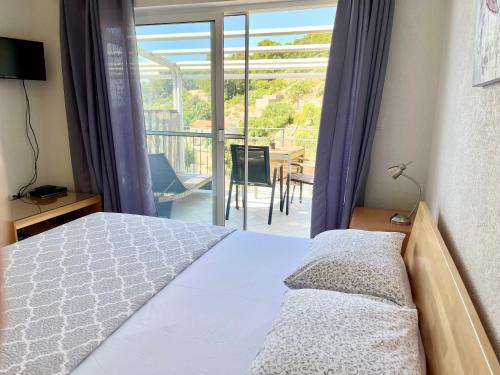 Postel nebo postele na pokoji v ubytování Paradise Apartments - Robinson getaway