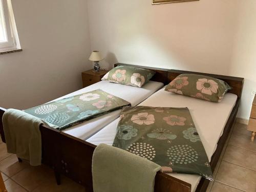 Ένα ή περισσότερα κρεβάτια σε δωμάτιο στο Apartment Bella 2