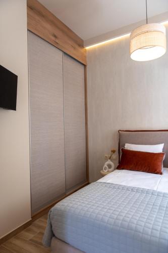 Postel nebo postele na pokoji v ubytování ikosapartments square 1-2