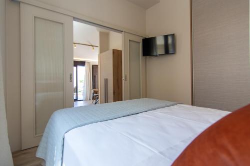 Postel nebo postele na pokoji v ubytování ikosapartments square 1-2