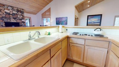 a kitchen with a sink and a stove at Wildflower Condo 617 in Sun Valley