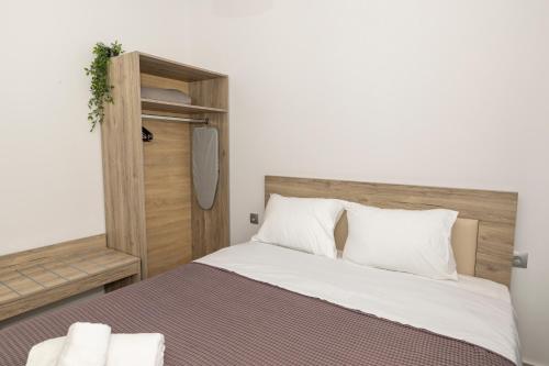 Postel nebo postele na pokoji v ubytování Mitende Apartments