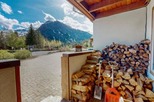 a pile of fire wood in front of a building at Basecamp Bliss in Olympic Valley