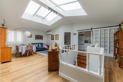 a kitchen and living room with a skylight at Vivenda da Bela Vista in Ponta Delgada