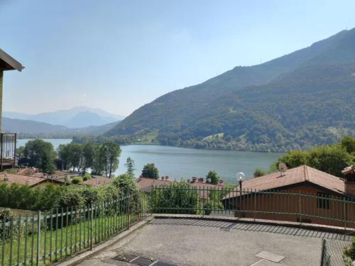 a view of a lake from a house at Lakefront Apartment with Panoramic Pool in Ranzanico