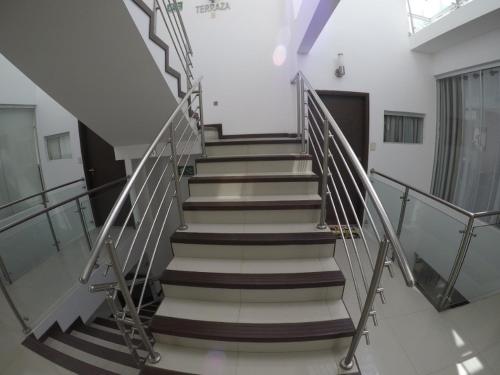 a stairway in a building with a railing at Serenity Palmas- in Santa Cruz de la Sierra
