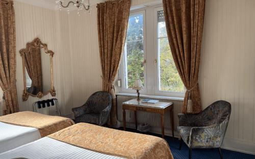 Postel nebo postele na pokoji v ubytování Hotel Restaurant Du Parc