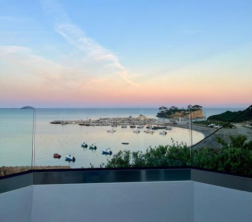a view of a beach with boats in the water at Osservatorio House in Laganas