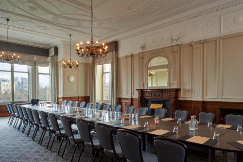 a conference room with a long table and chairs at The Milner York in York
