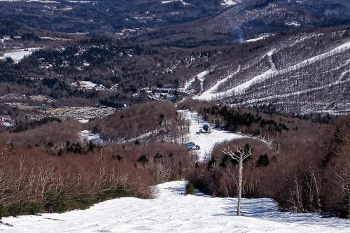 a view of a snow covered mountain with a ski slope at South Village #8 in Warren