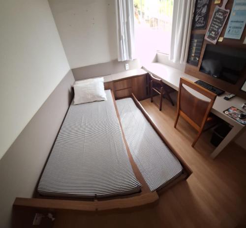 Katil atau katil-katil dalam bilik di Apartamento Completo com garagem - Diamantina