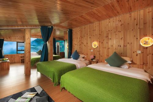 Postel nebo postele na pokoji v ubytování Longji Aplo Leisure B&B
