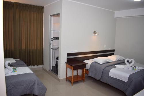 Katil atau katil-katil dalam bilik di Real Inka Hotel