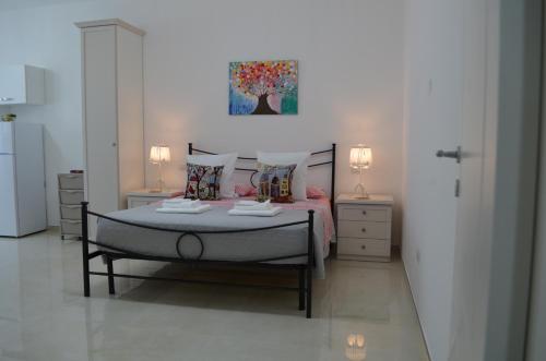Ένα ή περισσότερα κρεβάτια σε δωμάτιο στο Casa Low Cost