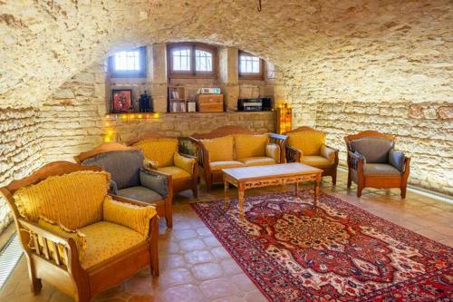 Posezení v ubytování Le Moulin , Cinema , Terrain Tennis