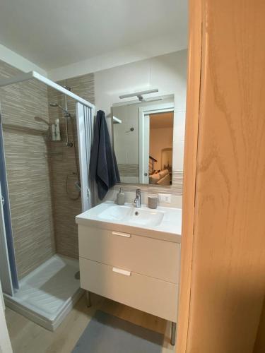 a bathroom with a sink and a shower at Casa Angelina in Molfetta