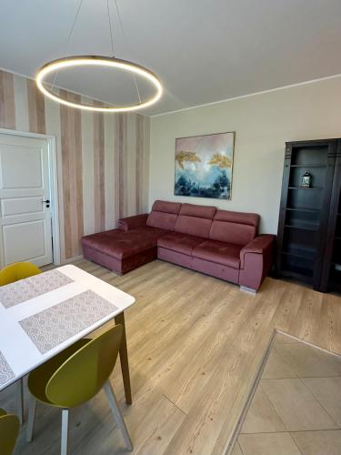 a living room with a couch and a table at Kesk 2 in Narva-Jõesuu