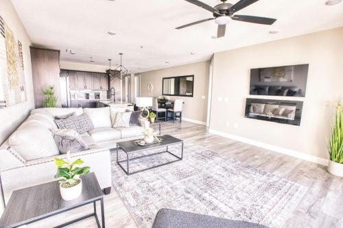 a living room with a couch and a table at Vacation Together at Our 2 Condos Providing 6 Bedroom Suites in Osage Beach