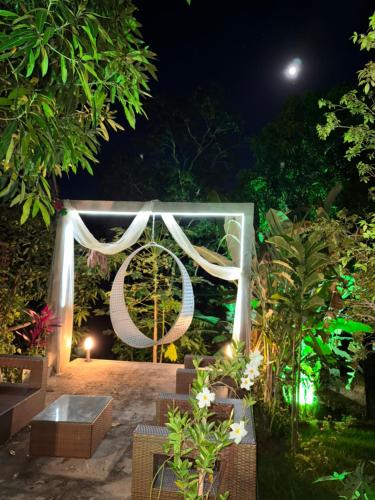 a wedding ceremony in a garden at night at Gbsitio in Brasilia