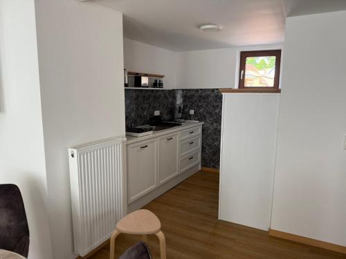 Kuchyň nebo kuchyňský kout v ubytování Ferienwohnung Vierjahreszeiten Sommer