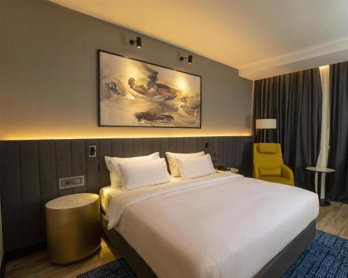 Cama o camas de una habitación en Radisson Blu Hotel & Conference Center, Niamey