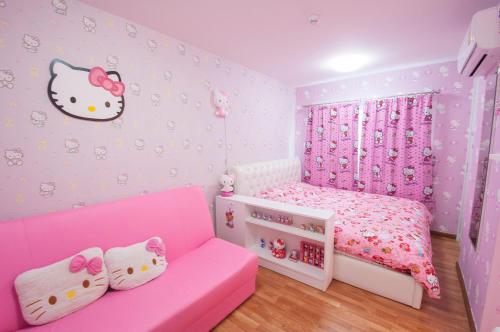 a childs bedroom with a pink hello kitty room at The Trust Hua Hin kitty room in Hua Hin